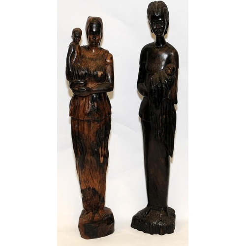 112 - Pair of large hand carved African figures depicting women with babies. Largest 65cms