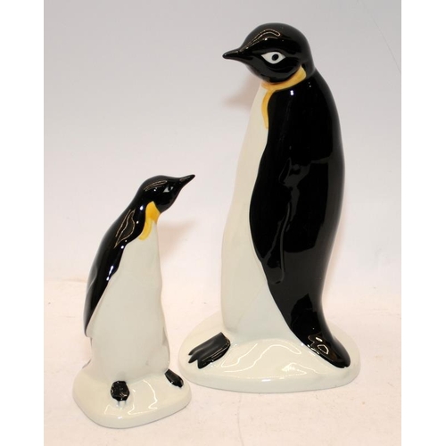 38 - Large and small hand painted Poole Pottery penguins. Largest is 23cms tall.