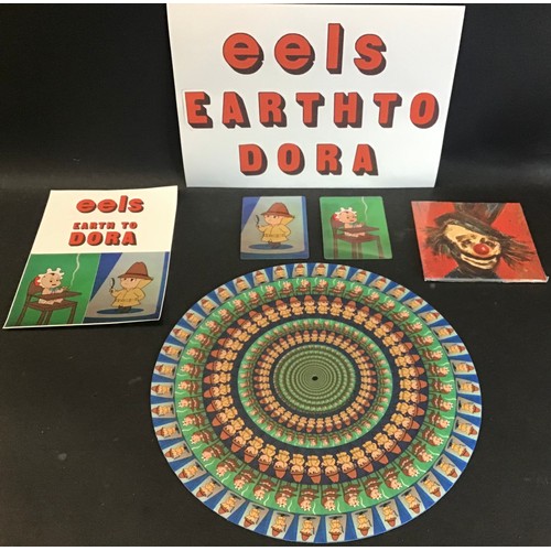 129 - EELS FACTORY BOX SET ‘EARTH TO DORA’. Included in this set we have a delux double 180g 12” 45rpm tra... 