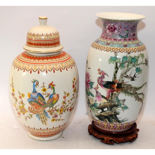 80 - Oriental lidded ginger jar c/w an Oriental baluster vase on a wooden stand. Both feature hand painte... 