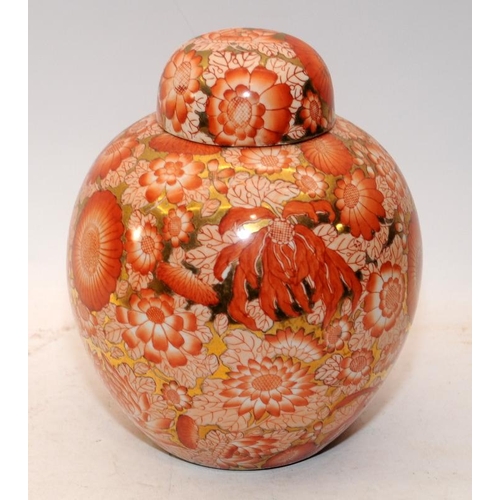 86 - Oriental lidded ginger jar featuring orange chrysanthemums c/w a 31cms charger with hand painted Ori... 