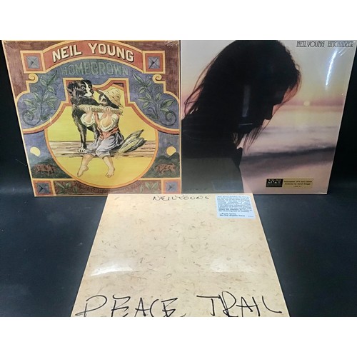 215 - NEIL YOUNG SEALED VINYL LP RECORDS X 3. Copies found here factory sealed include - Peace Trail - Hom... 