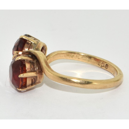 297 - 9ct Gold Double Twist Amber Ring. Size R