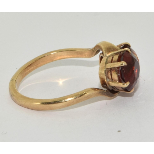 297 - 9ct Gold Double Twist Amber Ring. Size R