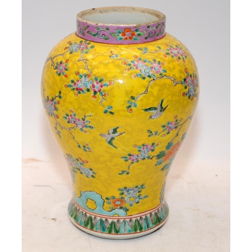 4 - Oriental Famille rose on yellow ground vase 24cms tall. signature and drilled hole to base