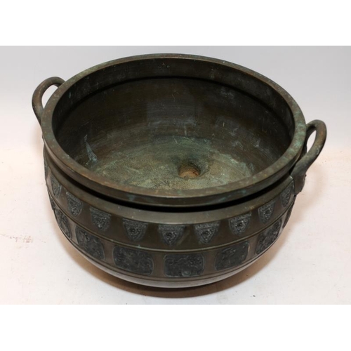 61 - Large 19thC Oriental bronze bowl on three feet with pictorial panel decoration. 37cms across