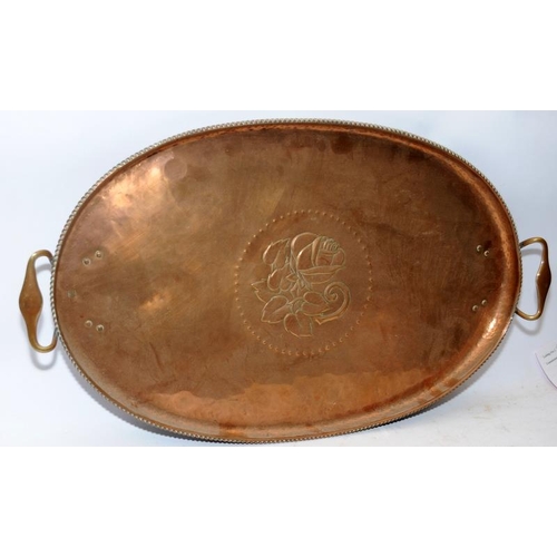 64 - Arts and Crafts large oval planished finish copper tray with handles by Hugh Wallis. 63cms across. L... 