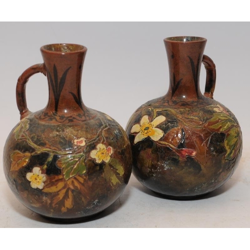 87 - Pair of early Watcombe Pottery small single handled jugs. 12cms tall