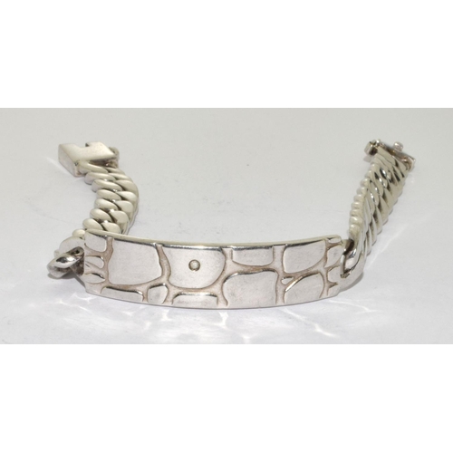 397 - A Silver ID style bracelet with diamond, 55g