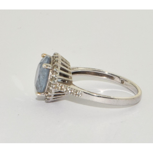 400 - A 925 silver, CZ and blue topaz ring Size P