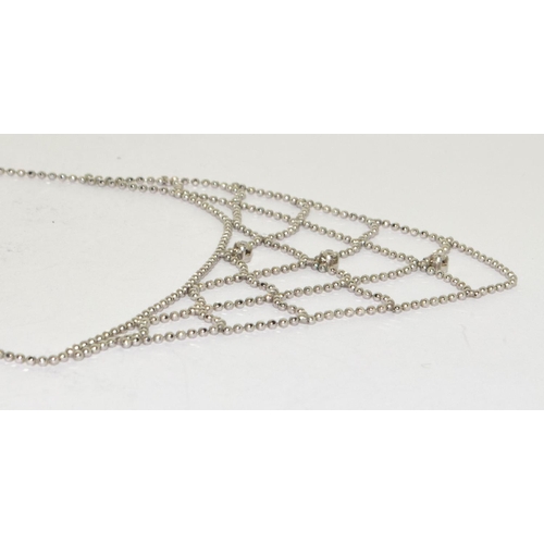 294 - A diamond and 9ct white gold spider web necklace.