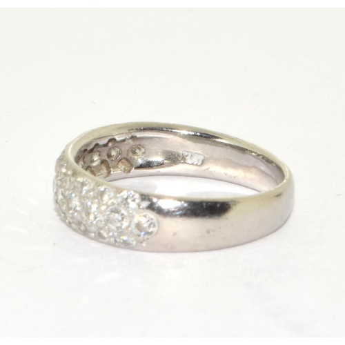 276 - A platinum and diamond set band ring Size M, 4.5g