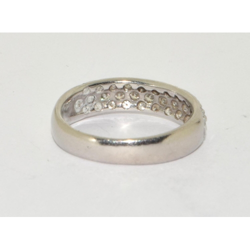 276 - A platinum and diamond set band ring Size M, 4.5g