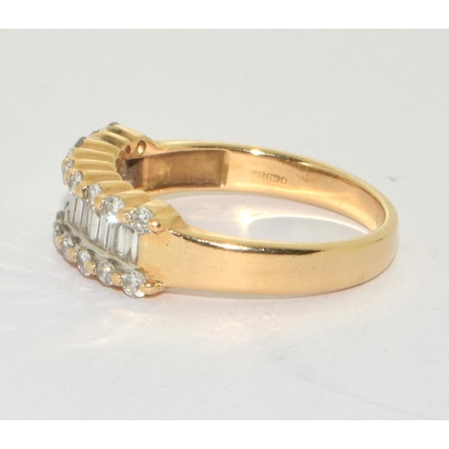 333 - An 18ct gold ring set with diamond baguette and round stones, Size N