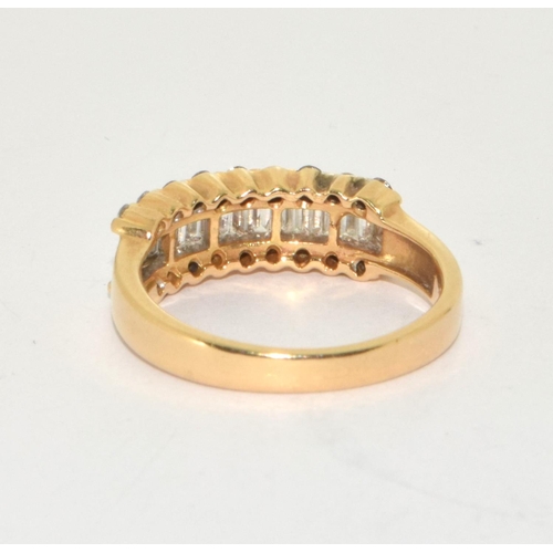 333 - An 18ct gold ring set with diamond baguette and round stones, Size N