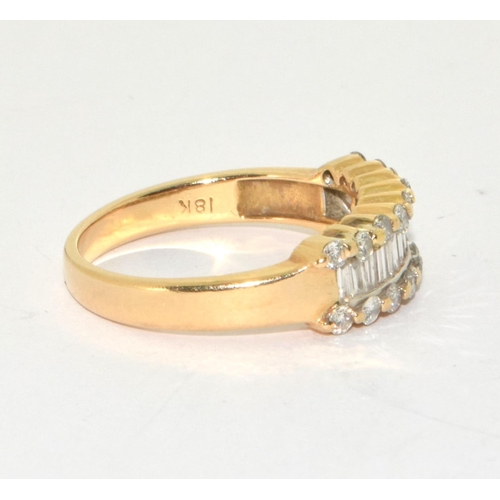 333 - An 18ct gold ring set with diamond baguette and round stones, Size N