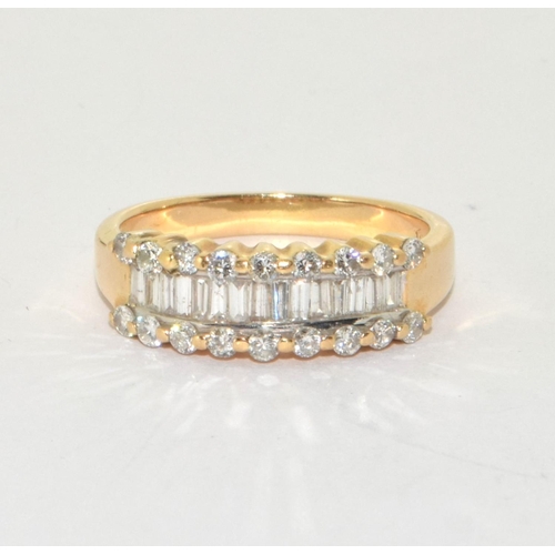 333 - An 18ct gold ring set with diamond baguette and round stones, Size N