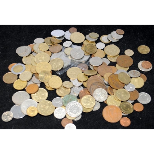 107 - A tin of mostly foreign coins and a wallet of banknotes