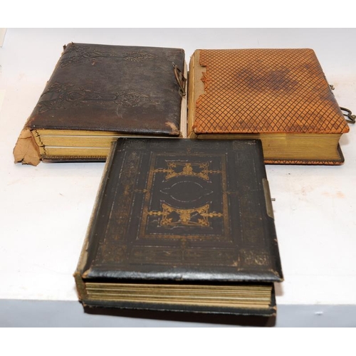 197 - Three antique photograph albums containing a good quantity of photographs and postcards