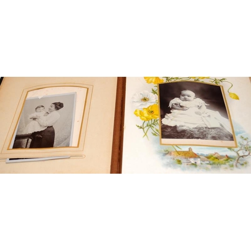 197 - Three antique photograph albums containing a good quantity of photographs and postcards