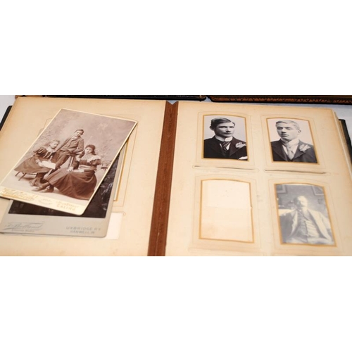 197 - Three antique photograph albums containing a good quantity of photographs and postcards