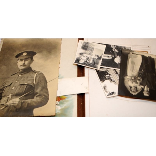 197 - Three antique photograph albums containing a good quantity of photographs and postcards