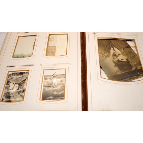 197 - Three antique photograph albums containing a good quantity of photographs and postcards