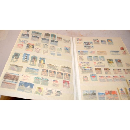 198 - 3 stock books containing a good number of USA postage stamps including early examples