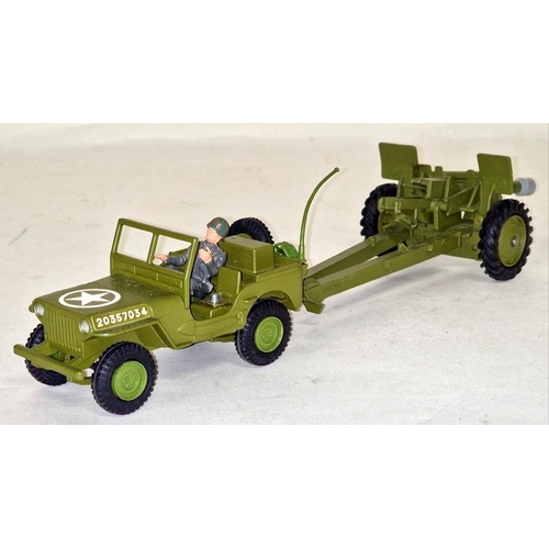 79 - Dinky toys U.S Jeep with 105mm Howitzer box not great shells missing