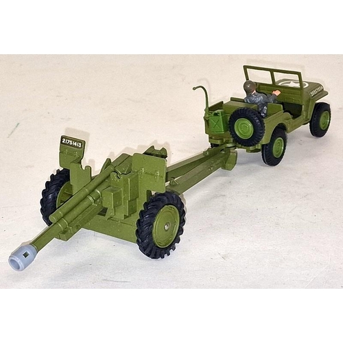 79 - Dinky toys U.S Jeep with 105mm Howitzer box not great shells missing