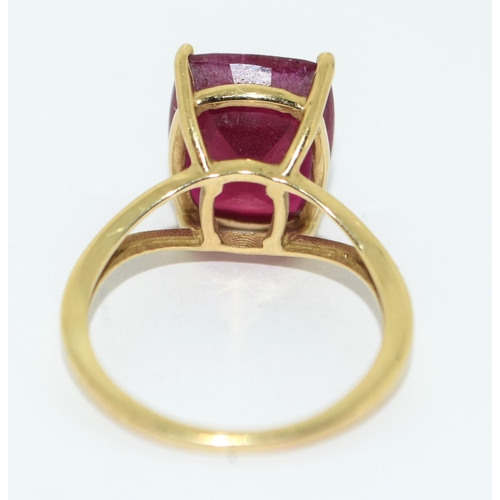 328 - A 9ct Gold Ladies Ruby Solitaire Ring. 8.5ct Cushion cut African Ruby, in open work setting,  Size L