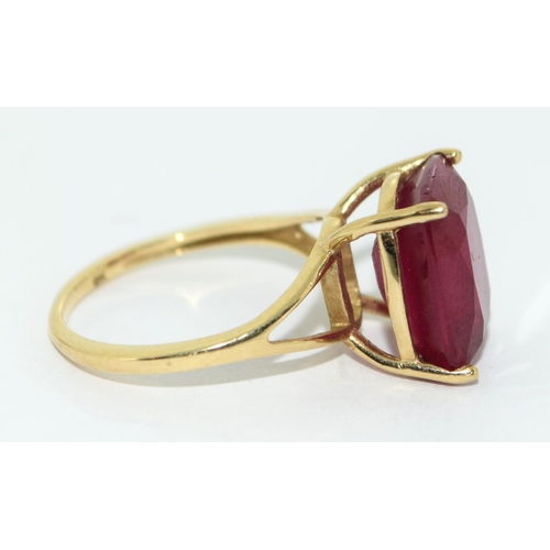 328 - A 9ct Gold Ladies Ruby Solitaire Ring. 8.5ct Cushion cut African Ruby, in open work setting,  Size L