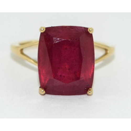 328 - A 9ct Gold Ladies Ruby Solitaire Ring. 8.5ct Cushion cut African Ruby, in open work setting,  Size L