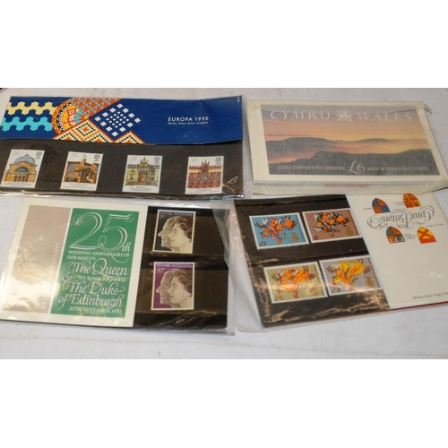 211 - Small collection of stamps to include presentation packs, and other mint and used stamps