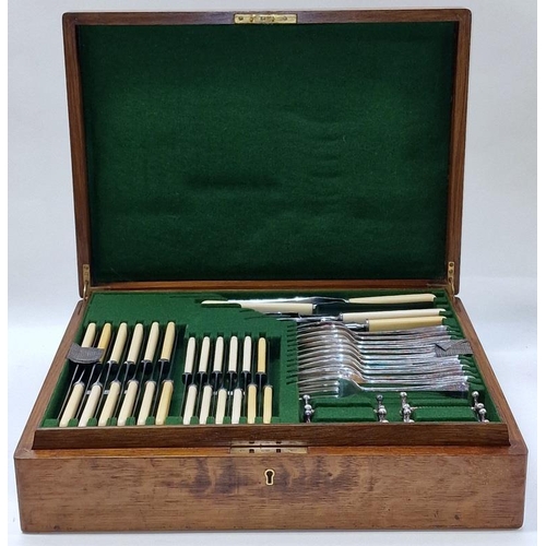 413 - Antique quality two tiered oak cutlery canteen containing a complete set of silver plated flatware f... 