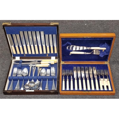 415 - Two vintage wooden cutlery canteens containing sets of flatware.