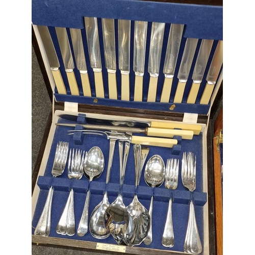 415 - Two vintage wooden cutlery canteens containing sets of flatware.