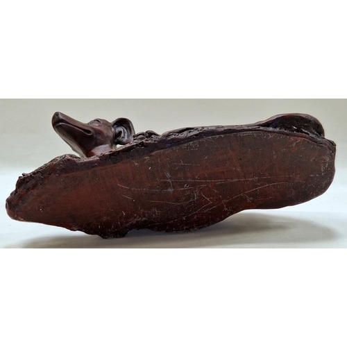 73 - A bronzed resin large figurine of a lying greyhound 52x29x21cm.