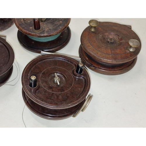 98 - Collection of five vintage centre pin fishing reels including Alcocks bakelite examples.