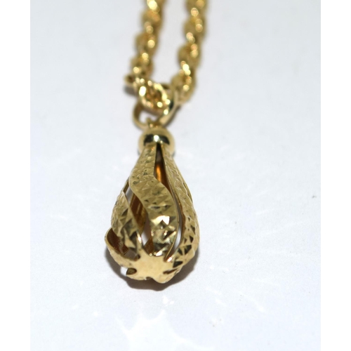 264 - 9ct gold rope chain necklace with an open work pendant 4g