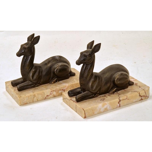 49 - A pair of vintage brass recumbent deer book ends on marble bases each measuring 13x16x9cm.