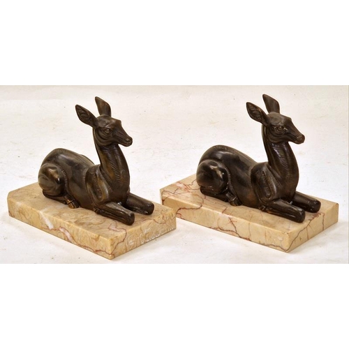 49 - A pair of vintage brass recumbent deer book ends on marble bases each measuring 13x16x9cm.