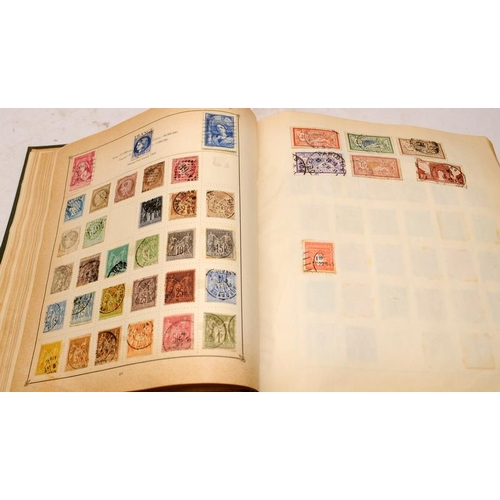 216 - Vintage 'The Strand' stamp album with a good selection of early world stamps. Worth looking through