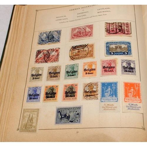 216 - Vintage 'The Strand' stamp album with a good selection of early world stamps. Worth looking through