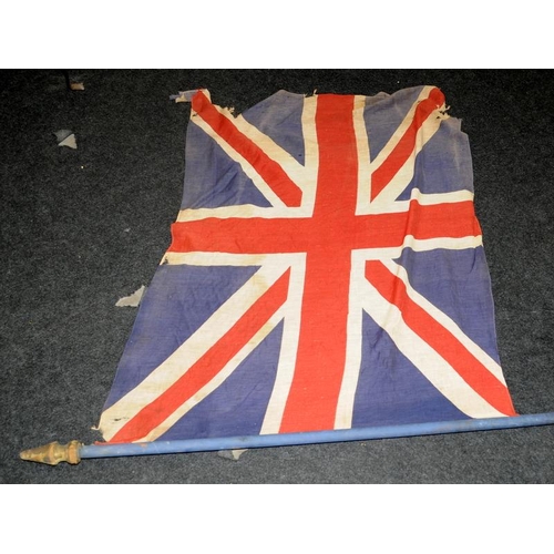 139 - Vintage distressed Union Flag on a wooden staff. 110cms x 83cms