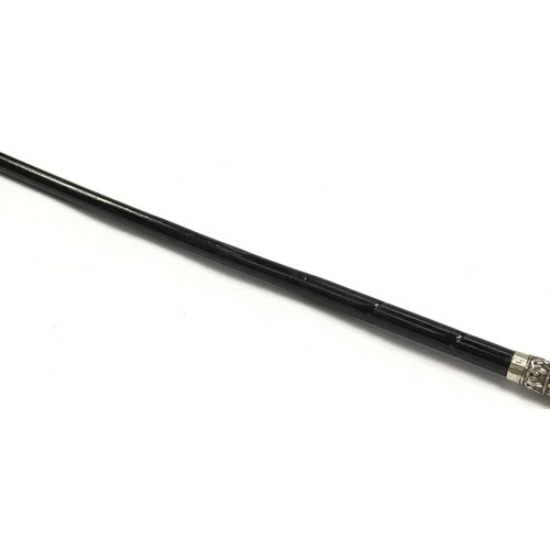 146 - Ebonized swagger stick with silver decorated handle (vendor advises this tests as silver although no... 