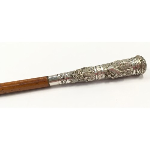 165 - Early Victorian swagger stick with white metal handle, highly decorated, 72cm long.