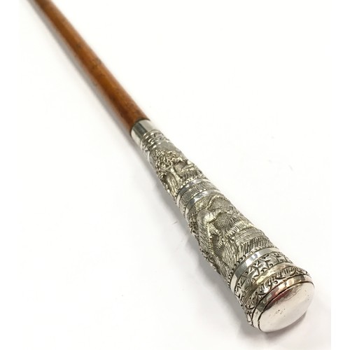 165 - Early Victorian swagger stick with white metal handle, highly decorated, 72cm long.