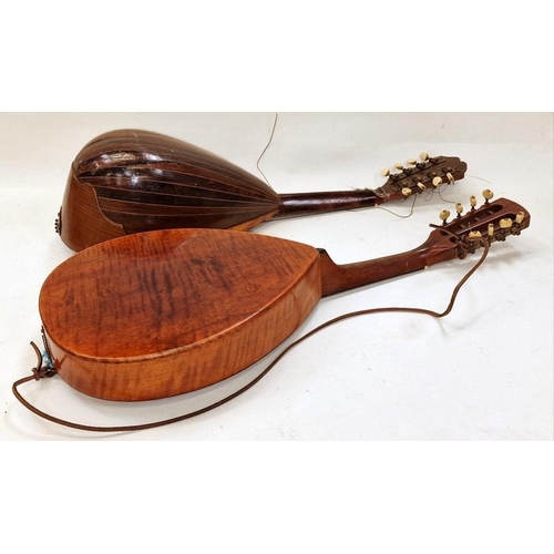 231 - A pair of antique mandolins with decorative mother of pearl inlay.