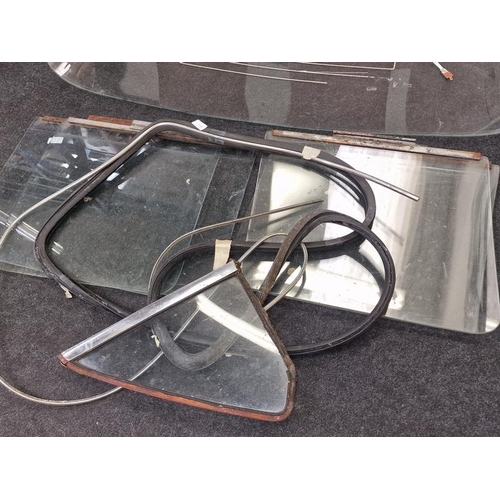 236 - Collection of vintage windscreens, side mirrors and windows. Vendor advises these may have come from... 